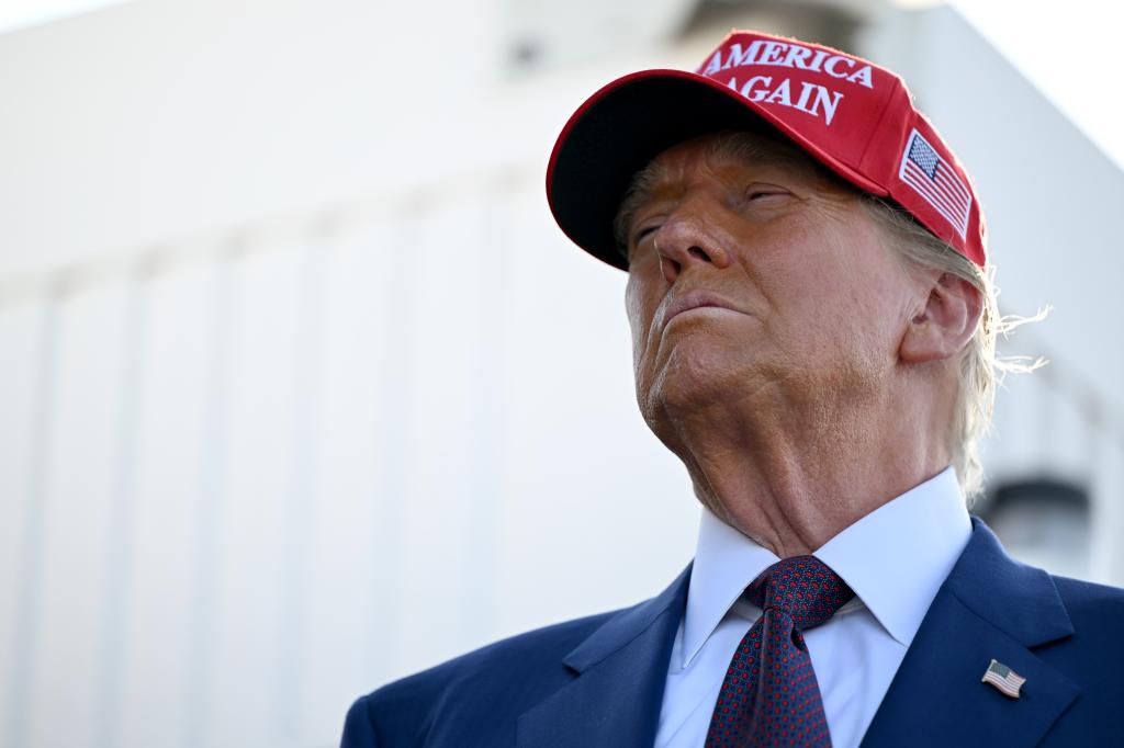 Donald Trump wearing a a Make America Great Again hat