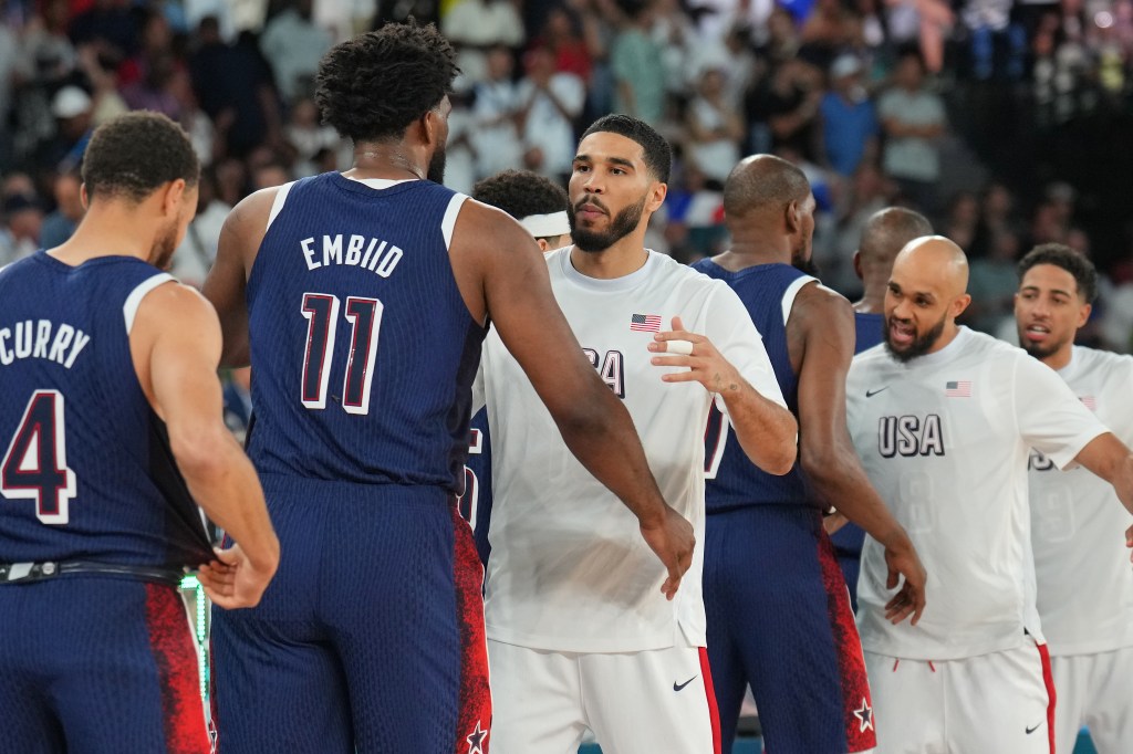 Stephen Curry #4, Joel Embiid #11, Jayson Tatum #10, Kevin Durant #7, Derrick White #8 look on during the Men's Gold Medal Game on August 10, 2024 at the AccorHotels Arena in Paris, France.  