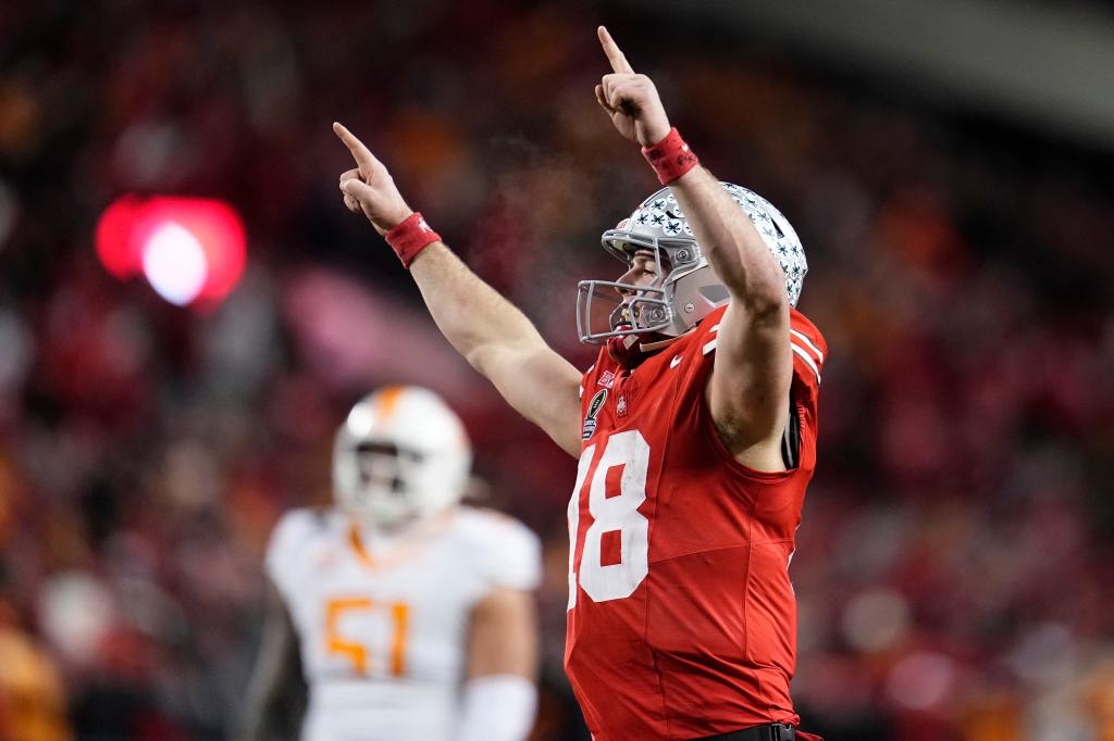 Ohio State Buckeyes quarterback Will Howard (18) celebrates after a touchdown by running back TreVeyon Henderson (not pictured) against the Tennessee Volunteers during the second half of the College Football Playoff first round game at Ohio Stadium. Ohio State won 42-17.