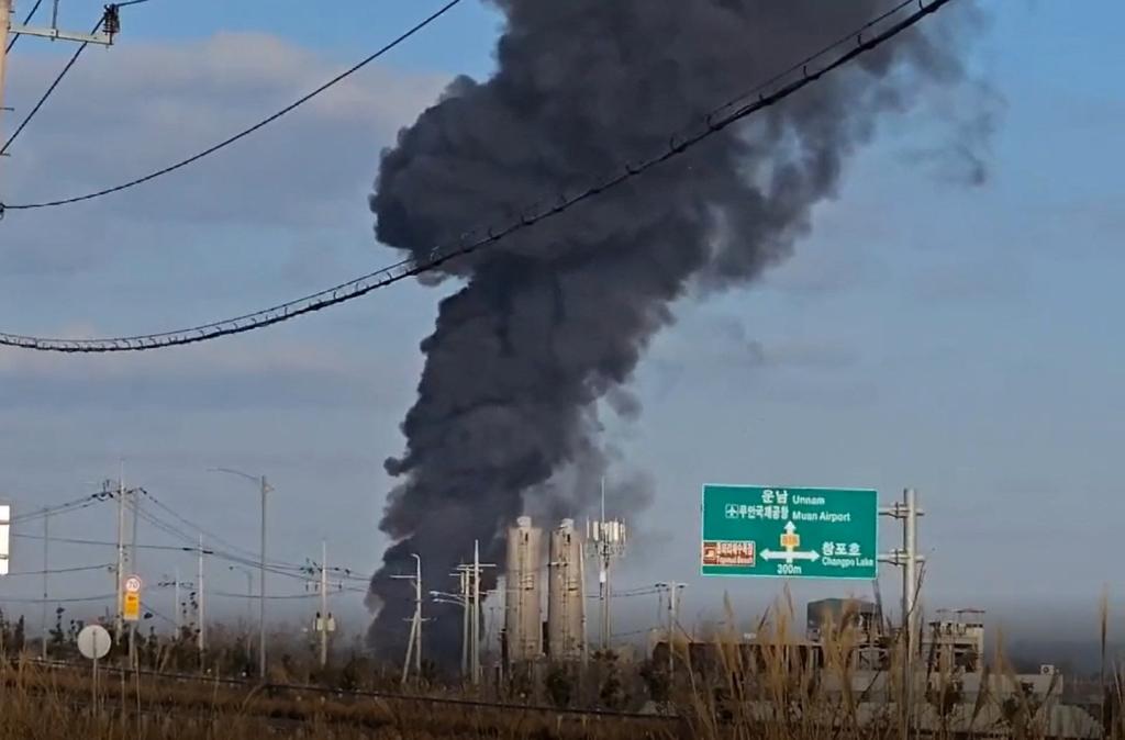 Black smoke billowing from Muan International Airport with ongoing rescue mission in South Jeolla Province, South Korea