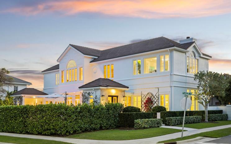 A waterfront estate in West Palm Beach with sweeping views of Mar-a-Lago and a Bulgari-inspired bar is on the market for $13.95 million.