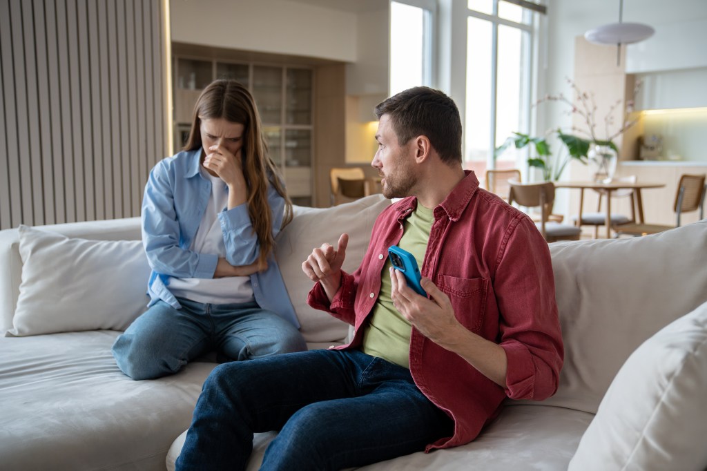 Angry irritated woman looking at man 