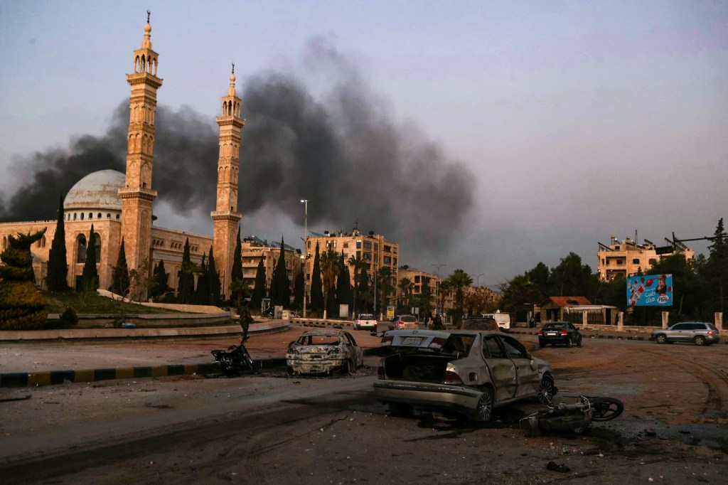 Smoke billows in Aleppo, Syria's largest city, as rebels fight the government's office.