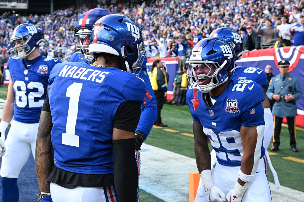 Giants receiverMalik Nabers (1) celebrates with running back Tyrone Tracy Jr. (29) after he scores a touchdown on Dec. 29, 2024.
