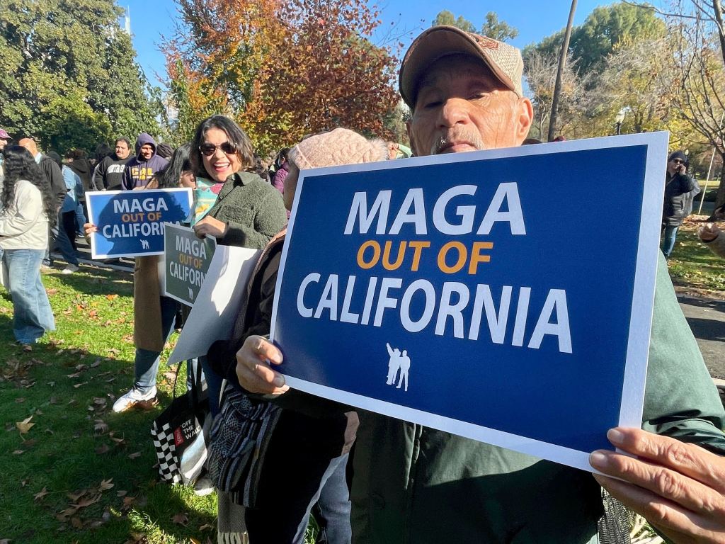 Immigration advocates hold a rally in Sacramento, Calif. on Monday, Dec. 2, 2024, to protest President-Elect Donald Trump's plans to conduct mass deportation of immigrants without legal status. 