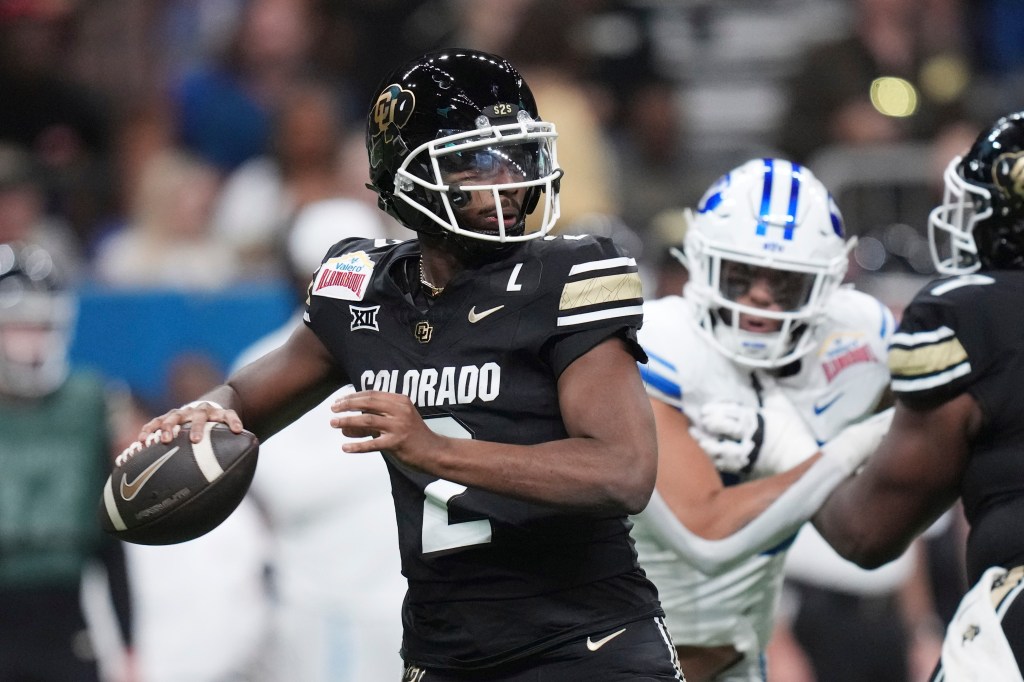Colorado quarterback Shedeur Sanders (2) looks to throw during the Alamo Bowl against BYU on Dec. 28, 2024.