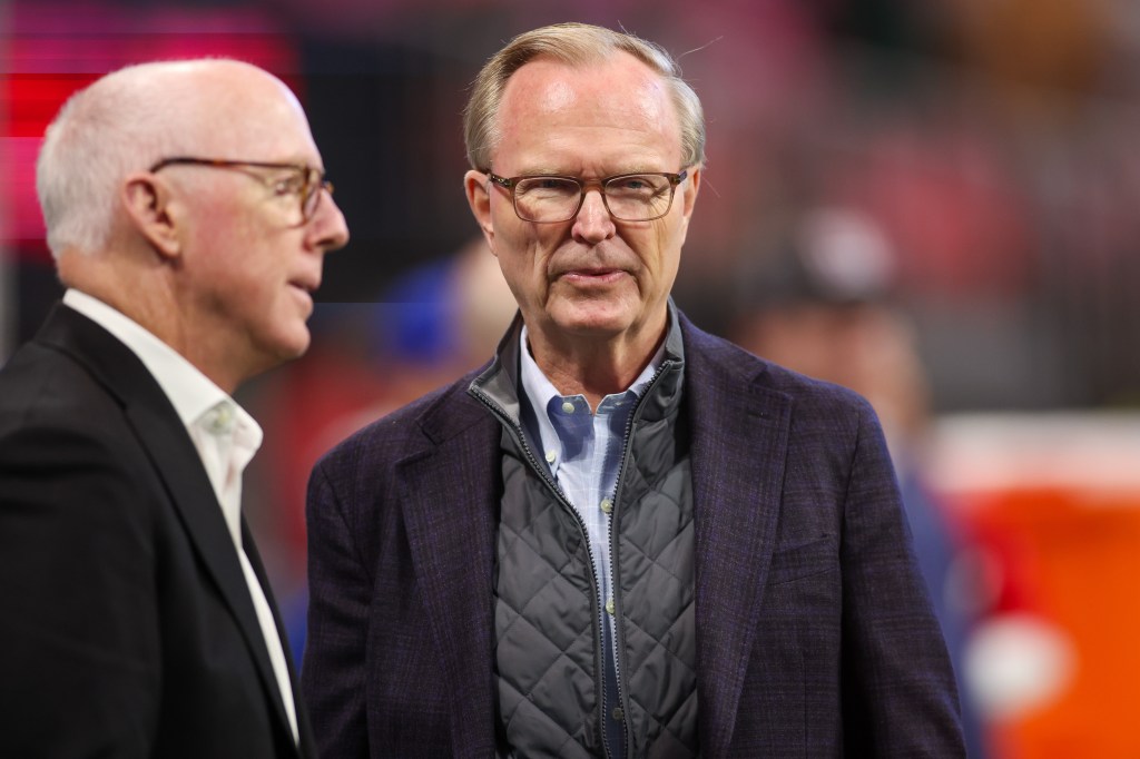John Mara on the field before the Giants-Falcons game on Dec. 22.