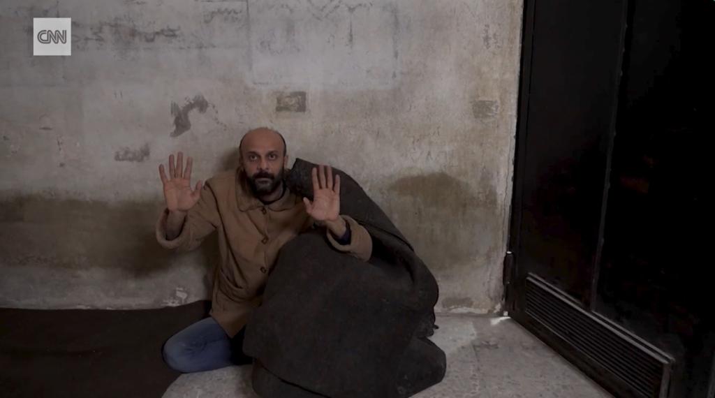 Salama was allegedly hiding behind a blanket when the rebels appeared with CNN at the Damascus prison.