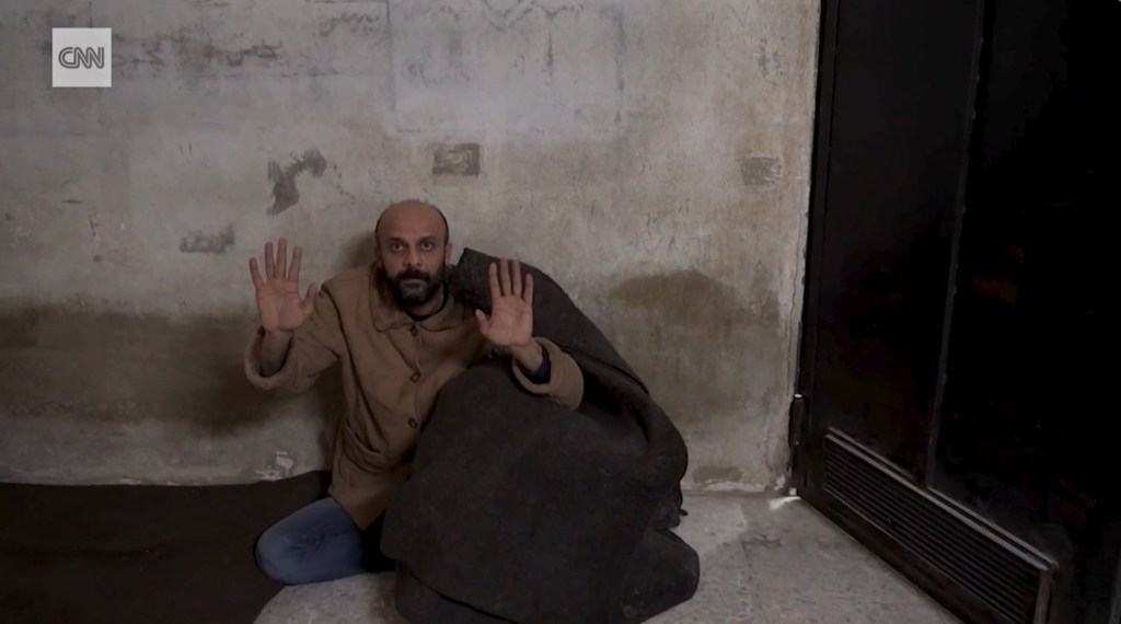 Salama was allegedly hiding behind a blanket when the rebels appeared with CNN at the Damascus prison.