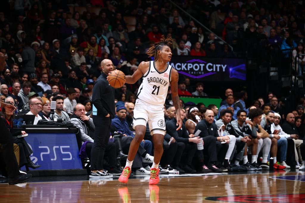 Noah Clowney of the Brooklyn Nets dribbling the ball during a game against the Toronto Raptors