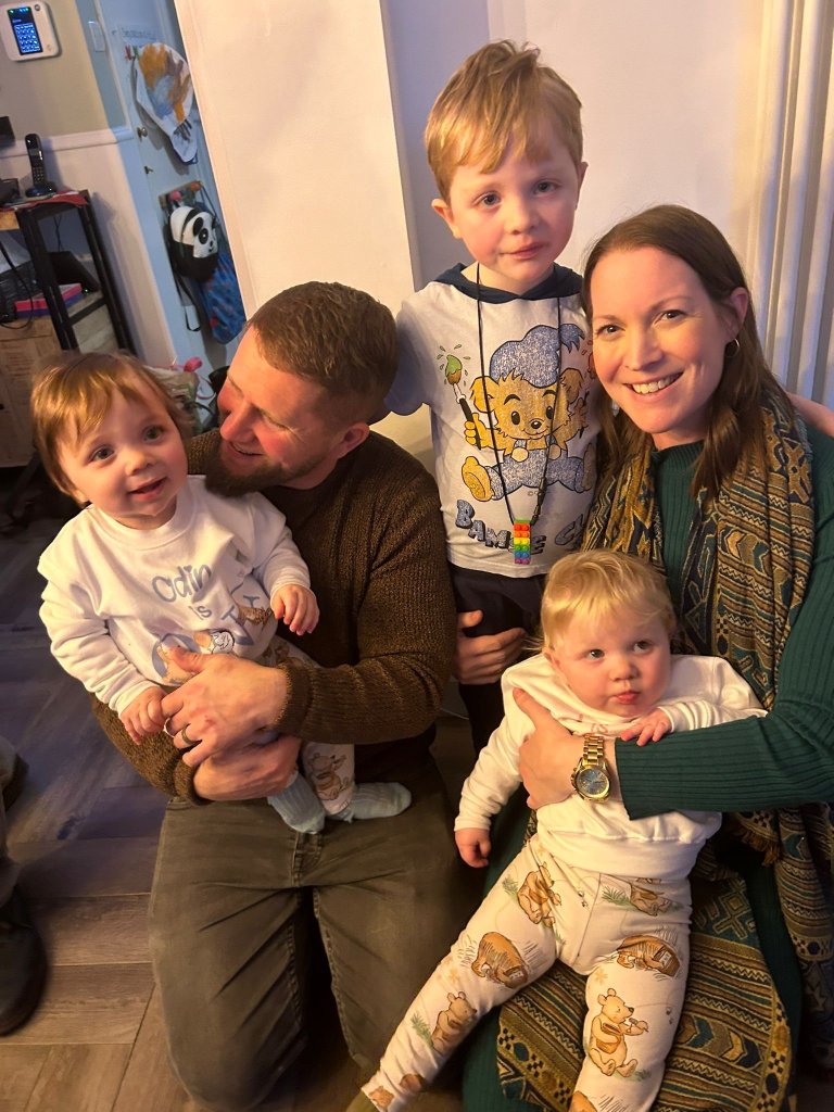 Zoe Gardner-Lawson smiles alongside her husband and three children.