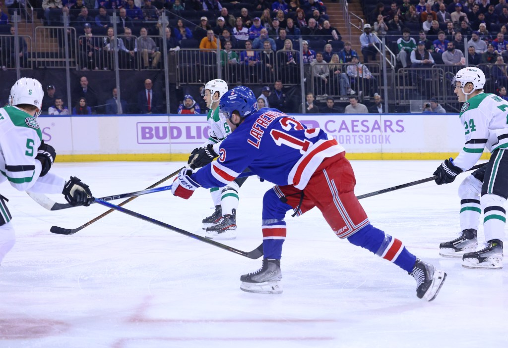 New York Rangers left wing Alexis Lafrenière (13) scores a goal during the first period 