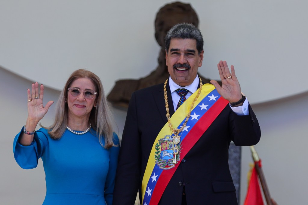 President of Venezuela Nicolas Maduro and his wife Cilia Flores holding hands and posing for photos after his swear-in ceremony for a third term in Caracas, Venezuela.