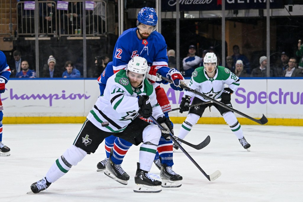 New York Rangers center Filip Chytil (72) and Dallas Stars center Sam Steel (18) battle for a loose puck during the second period at Madison Square Garden.