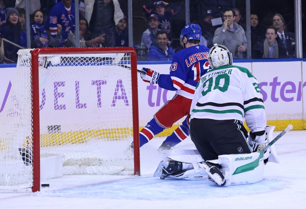 Alexis Lafreniere scores the first of his two goals during the Rangers' OT loss.