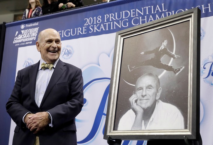 Dick Button Dick Button smiles next to a painting of him while honored at the U.S. Figure Skating Championships in San Jose, Calif. on Jan. 4, 2018. 