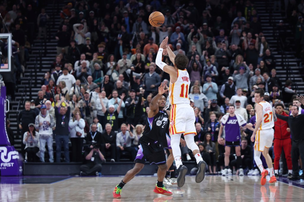 Trae Young hits a buzzer-beating 3-pointer from beyond halfcourt to give the Hawks a 124-121 win over the Jazz on Jan. 7, 2025. 
