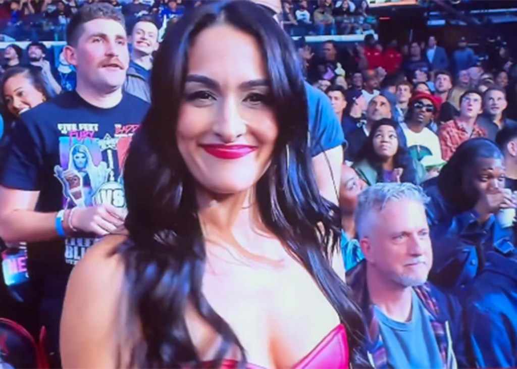Nikki Bella gets honored by WWE as Bill Simmons is captured in the background at "Monday Night Raw" on Netflix on January 6, 2025.