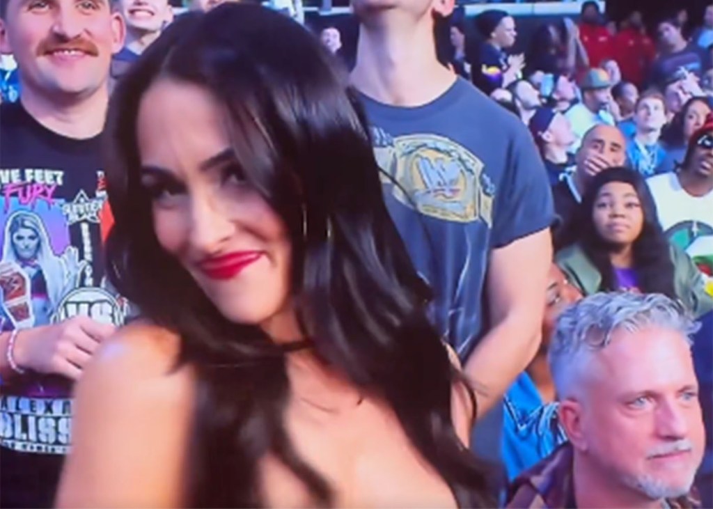 Nikki Bella gets honored by WWE as Bill Simmons is captured in the background at "Monday Night Raw" on Netflix on January 6, 2025.  