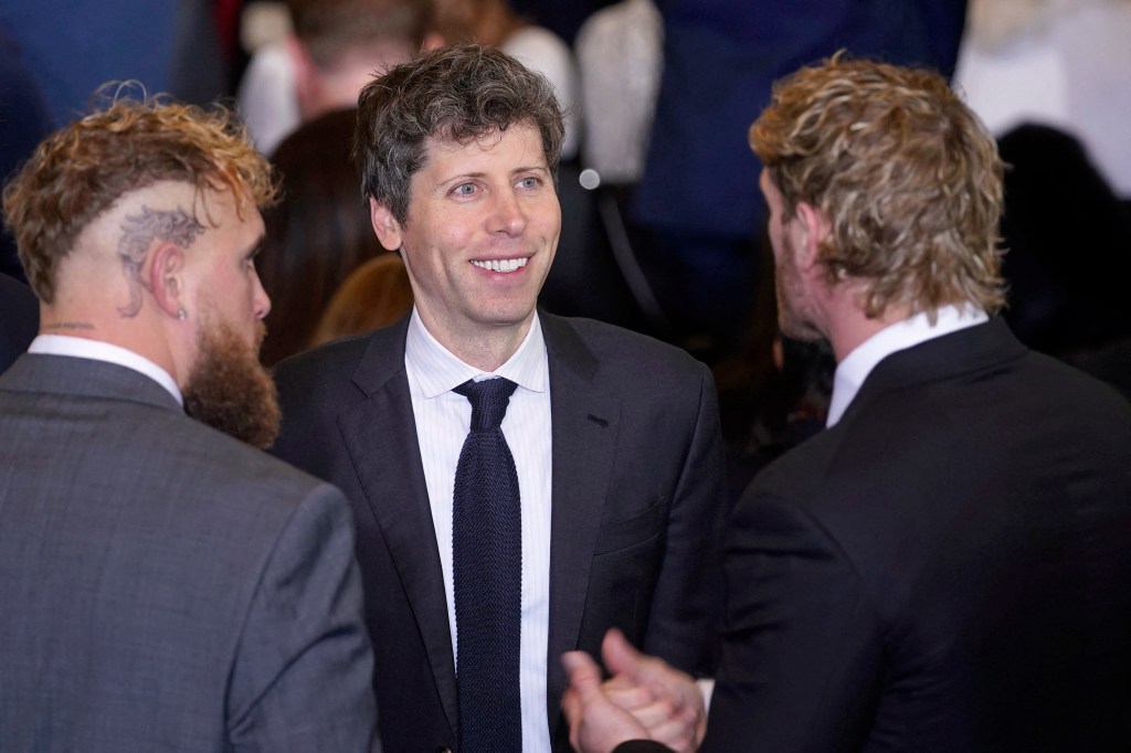 Sam Altman, CEO of OpenAI, shaking hands with boxer Jake Paul and wrestler Logan Paul at Donald Trump's inauguration ceremony in 2025