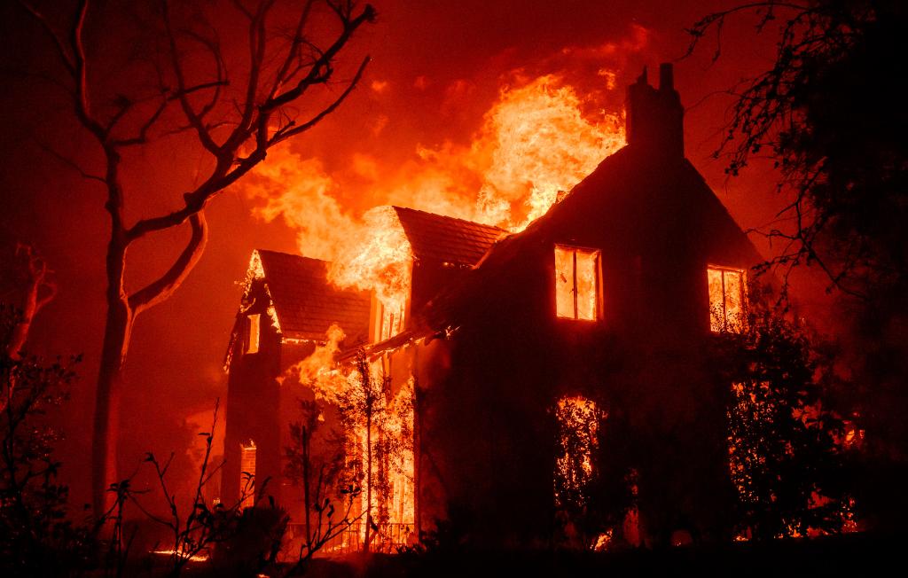 A home burns during the Eaton Fire