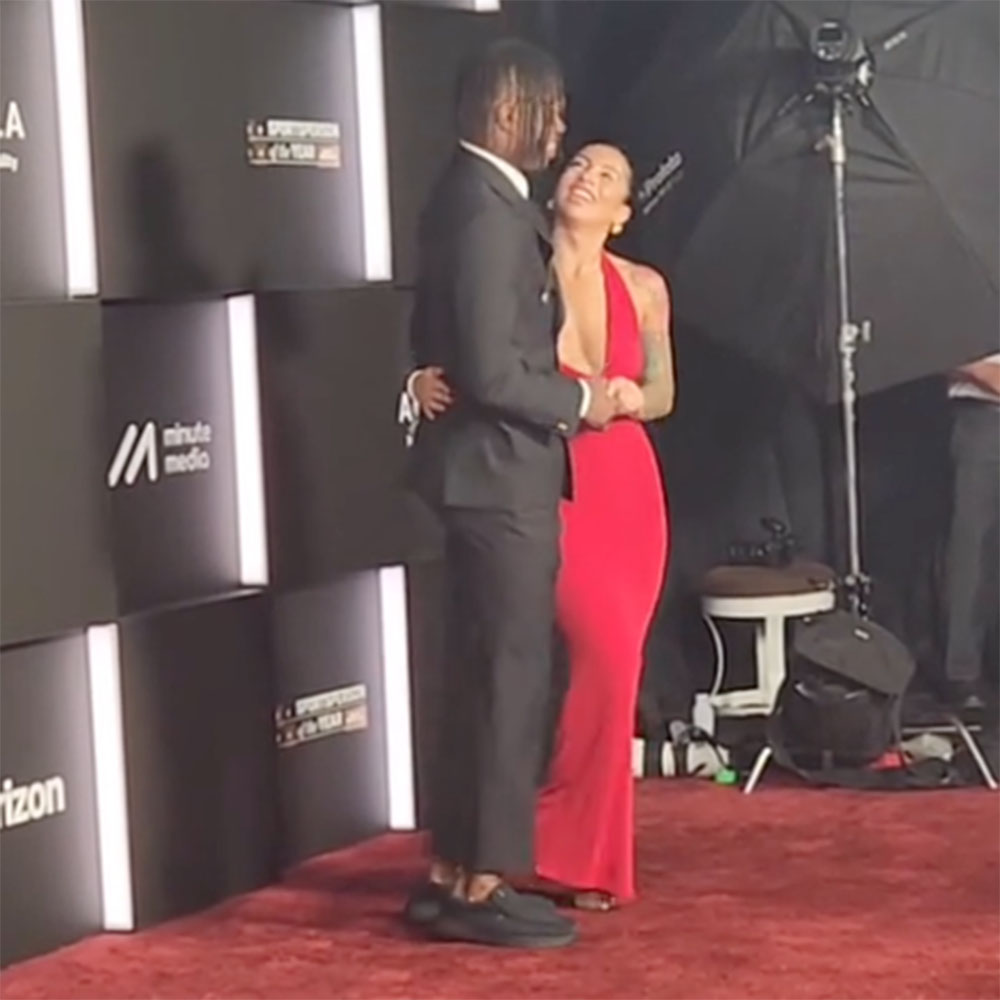 Travis Hunter and his fiancée Leanna Lenee on the red carpet at Sports Illustrated's annual awards ceremony at the Wynn in Las Vegas on January 7, 2025.