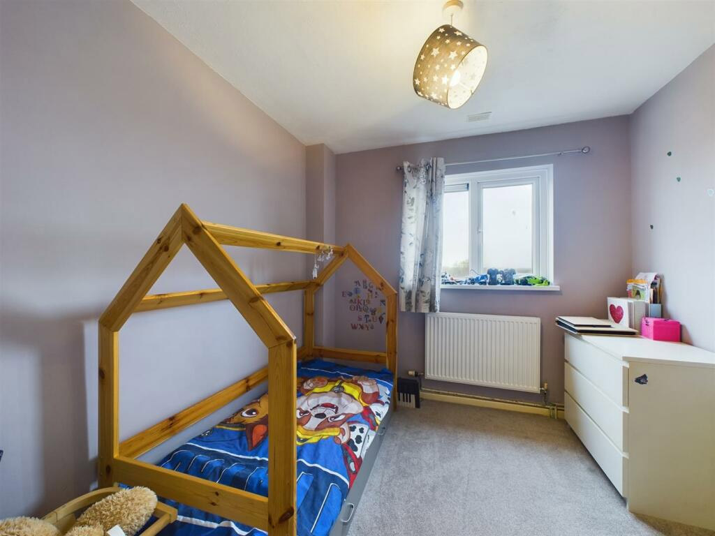 One of three bedrooms. 