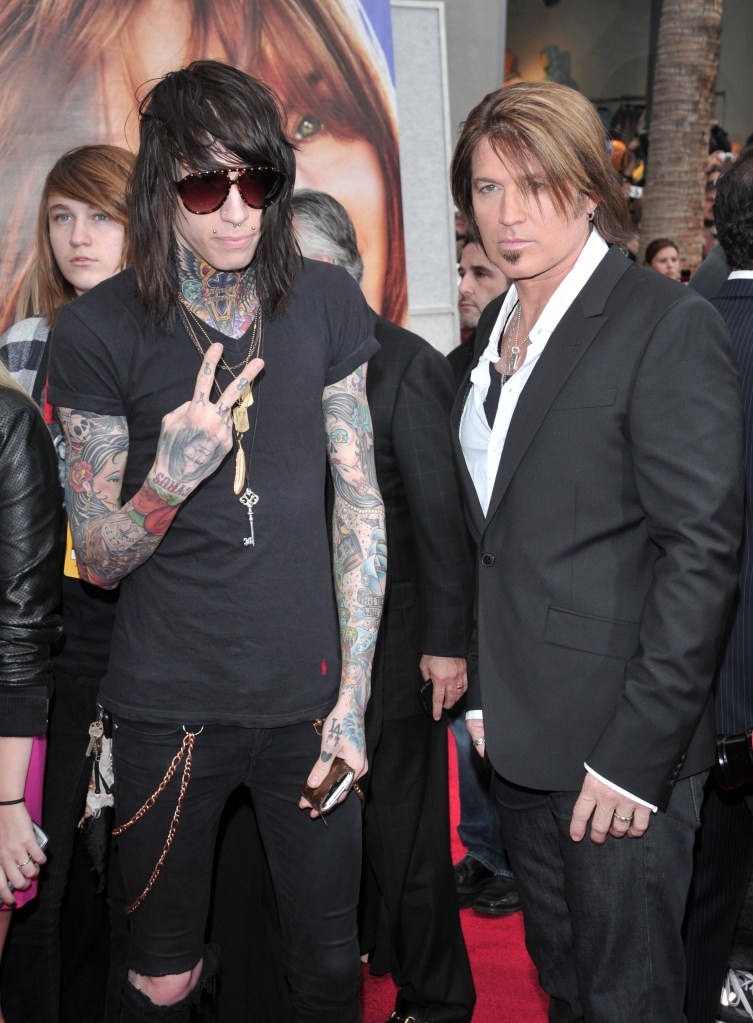 Trace and Billy Ray Cyrus at the "Hannah Montana: The Movie" film premiere in 2009.