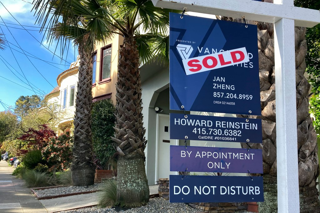 Sold sign in front of home