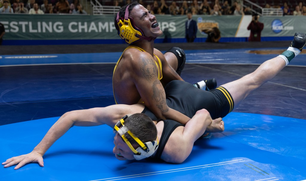 Jharrel Jerome as Anthony Robles, wrestling another man in a scene from the film 'Unstoppable'