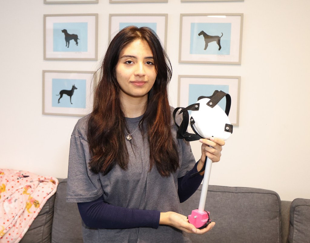 Sarah Barros, President of the Southampton HS robotics team with the 3D printed leg she created 