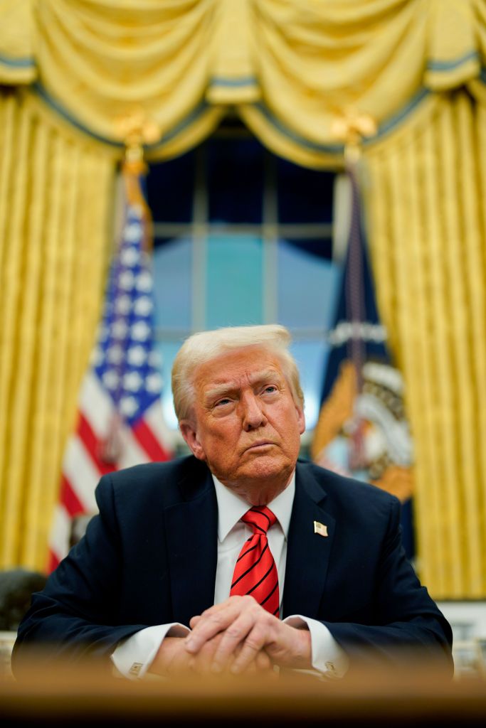 US President Donald Trump signing an executive order in the Oval Office of the White House, planning to impose 25% tariffs on steel and aluminum imports on 10 February 2025.