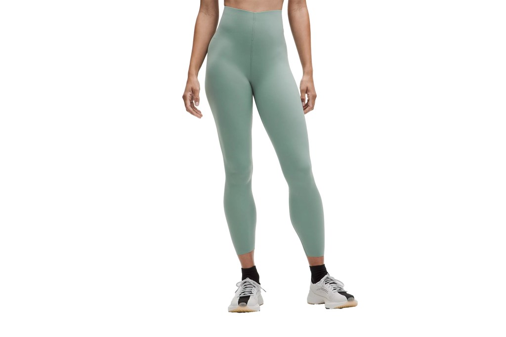 A person wearing tights and sneakers