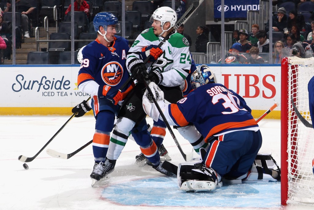 Brock Nelson #29 and Ilya Sorokin #30 of the Islanders defend against Roope Hintz of the Dallas Stars during the third period at UBS Arena on February 23, 2025 in Elmont, New York. 