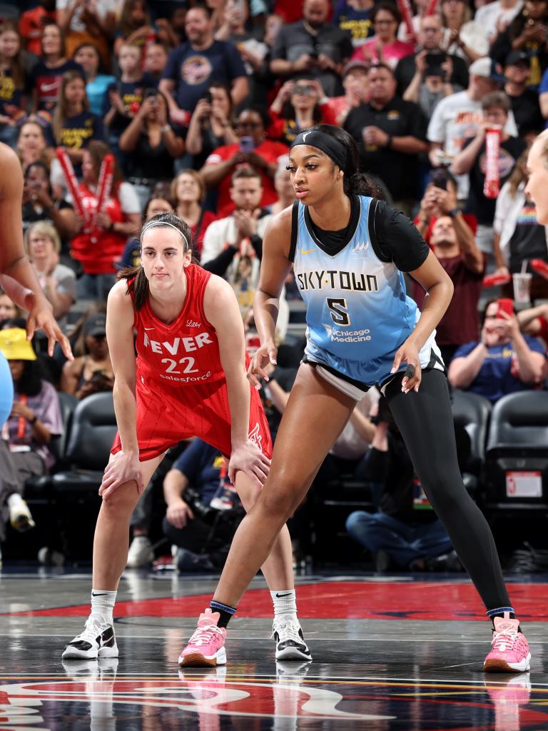 Caitlin Clark #22 of the Indiana Fever and Angel Reese #5 of the Chicago Sky look on during the game on June 1, 2024 at Gainbridge Fieldhouse in Indianapolis, Indiana.