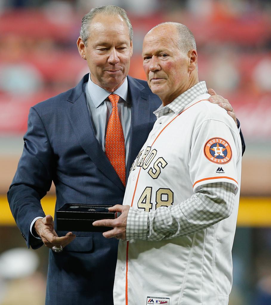 Houston Astros owner Jim Crane presents retired first base coach Rich Dauer with his championship ring at Minute Maid Park on April 3, 2018 in Houston, Texas.