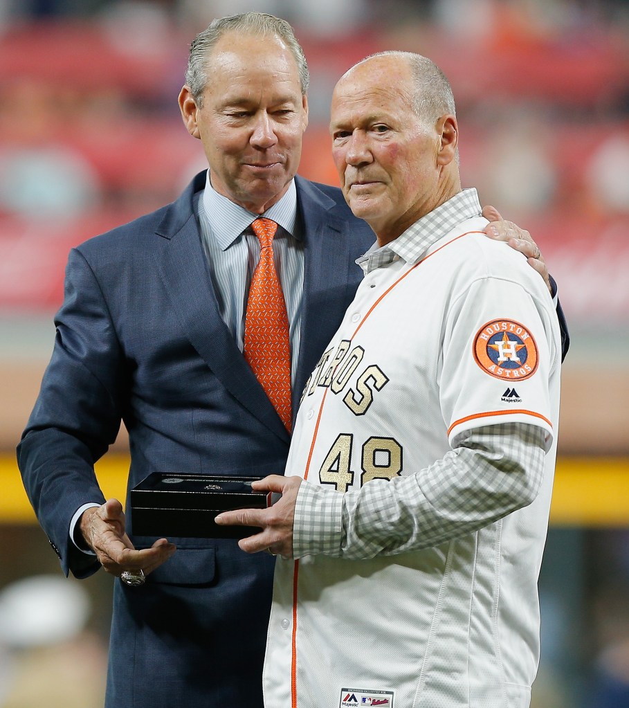 Houston Astros owner Jim Crane presents retired first base coach Rich Dauer with his championship ring at Minute Maid Park on April 3, 2018 in Houston, Texas.