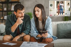 Serious adult couple, one resembling Thomai Apergi, sitting and calculating their monthly domestic finances