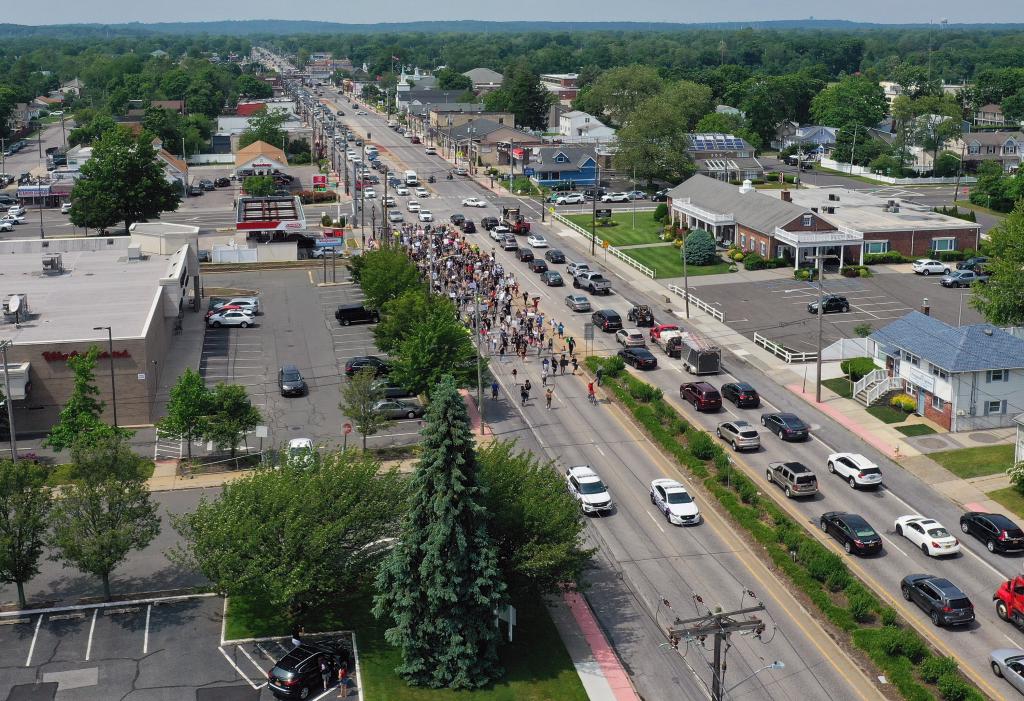 In an aerial view from a drone, demonstrators march in support of the Black Lives Matter Movement on June 06, 2020 in Deer Park, New York.