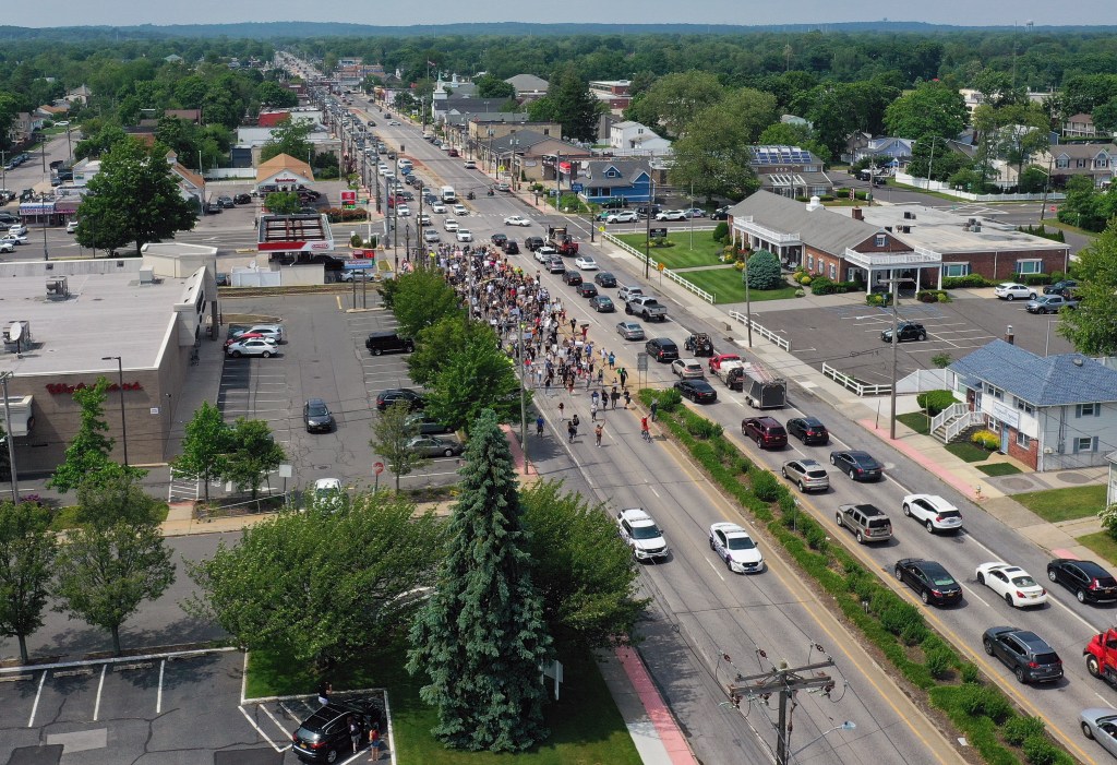 In an aerial view from a drone, demonstrators march in support of the Black Lives Matter Movement on June 06, 2020 in Deer Park, New York.
