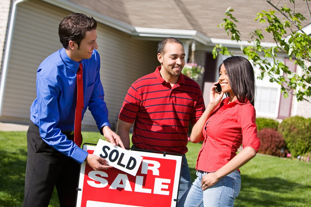 Extensive series of a Real Estate Agent and Couple in front of a home.