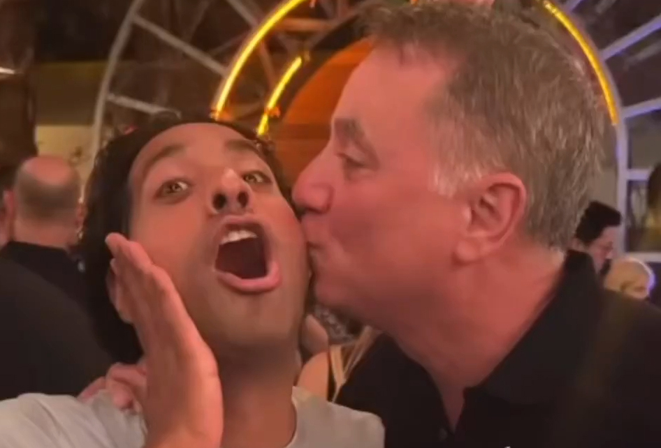Jefferies CEO, Rich Handler, kissing Phil Mason's cheek at a Miami event on January 28, as depicted in a social media post