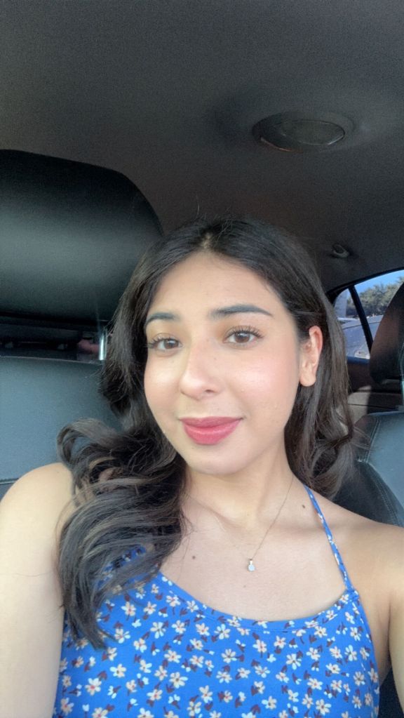 Young woman, Jazmin Garza takes s selfie in the car