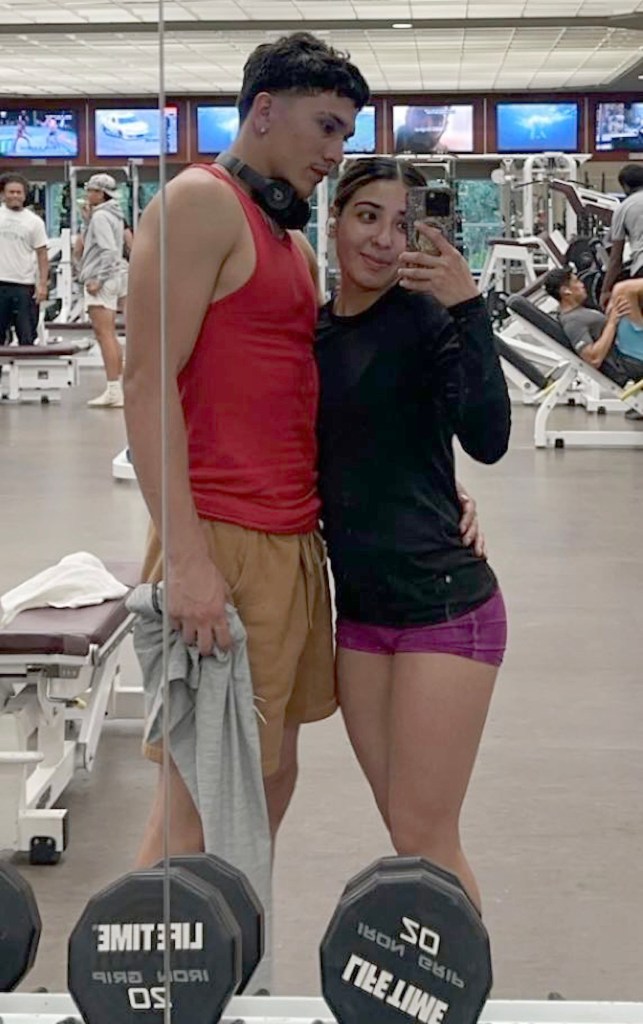 Jazmin Garza and Isaac Ayala take a mirror selfie at the gym