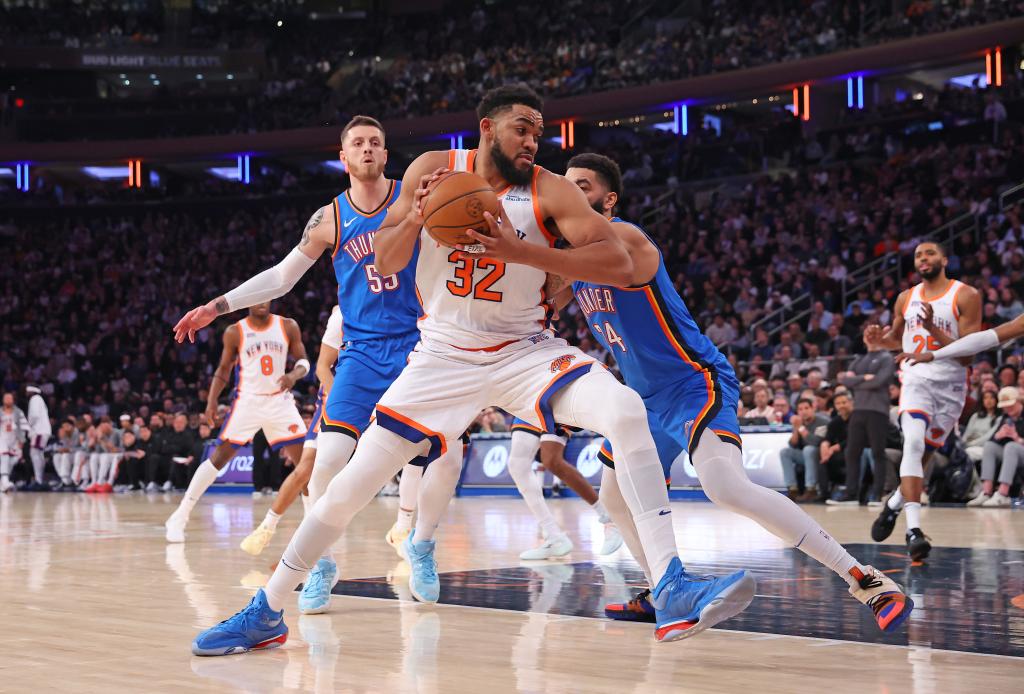 New York Knicks center Karl-Anthony Towns #32 drives to the basket as Oklahoma City Thunder forward Kenrich Williams #34 defends on Jan. 10, 2025. 