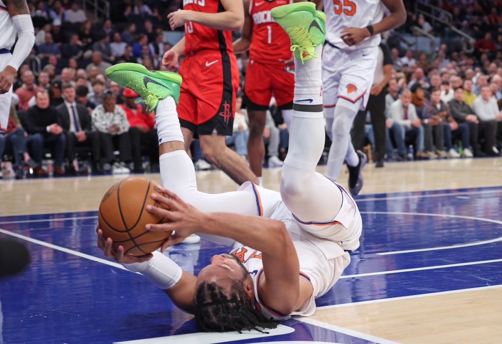 Jalen Brunson falls during Knicks' game against the Rockets.