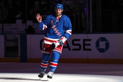 New York Rangers center J.T. Miller (8) waves to fans after a 4-2 win against the Vegas Golden Knights at Madison Square Garden.