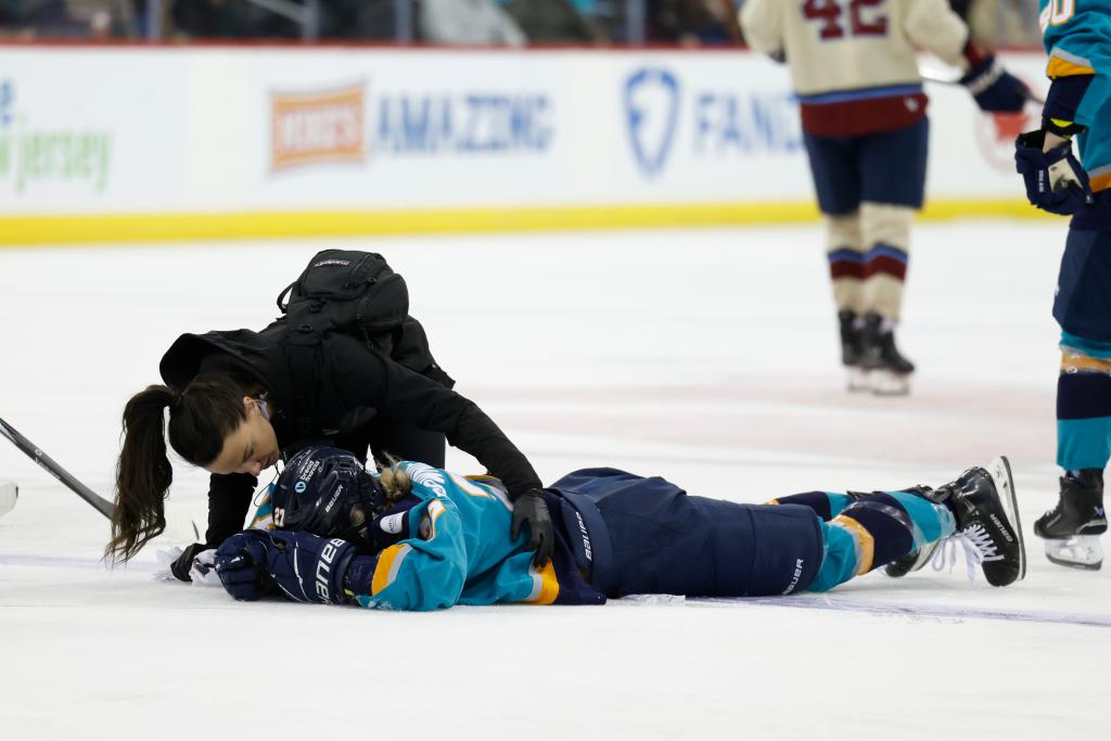New York Sirens Jade Downie-Landry is checked on by a trainer during the second period at the Prudential Center, Sunday, Feb. 2, 2025, in Newark, NJ. 