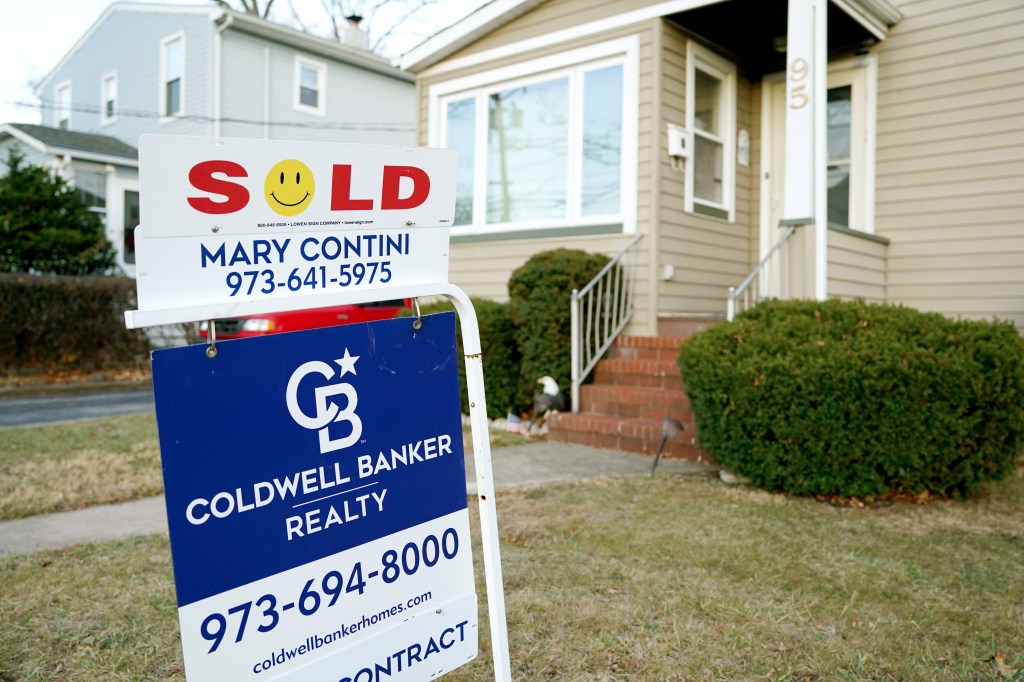 Sold sign in front of home