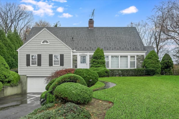 Gray, two-story Short Hills home.